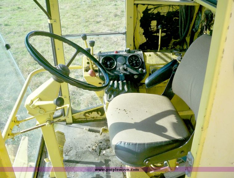 image for item 7531 New Holland TR70 combine with 20' platform with finger reel