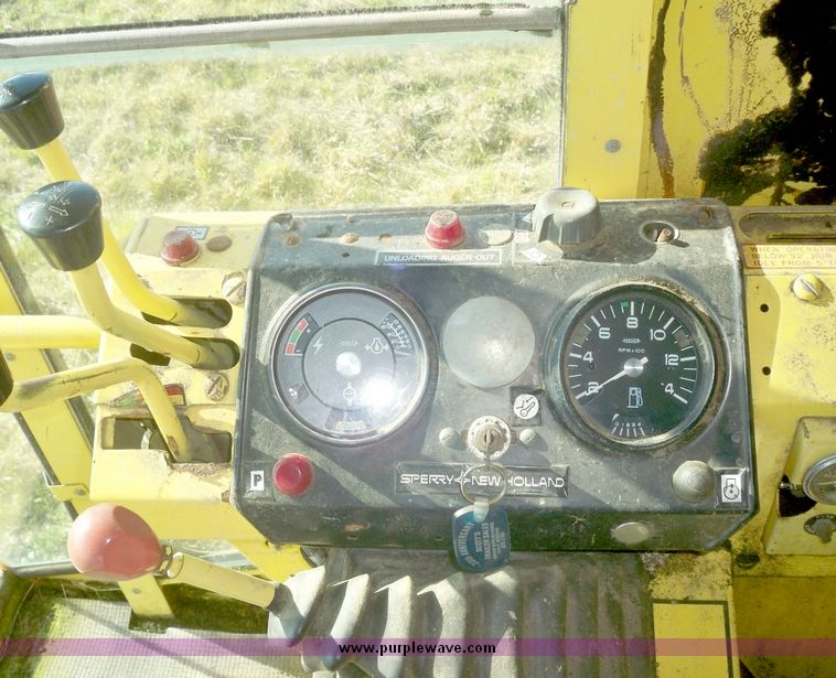 image for item 7531 New Holland TR70 combine with 20' platform with finger reel