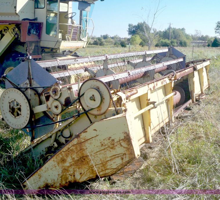 image for item 7531 New Holland TR70 combine with 20' platform with finger reel