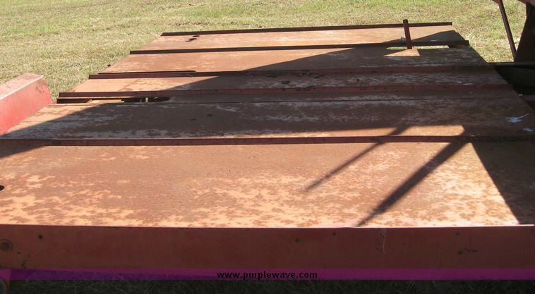 image for item 7999 New Holland 1033 pull type stack hand