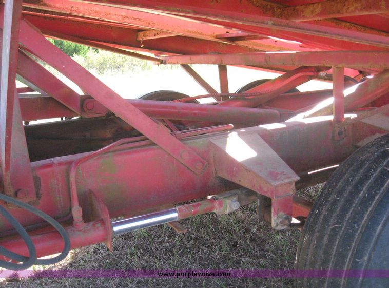 image for item 7999 New Holland 1033 pull type stack hand