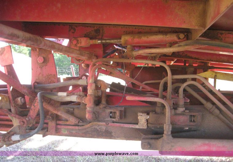 image for item 7999 New Holland 1033 pull type stack hand