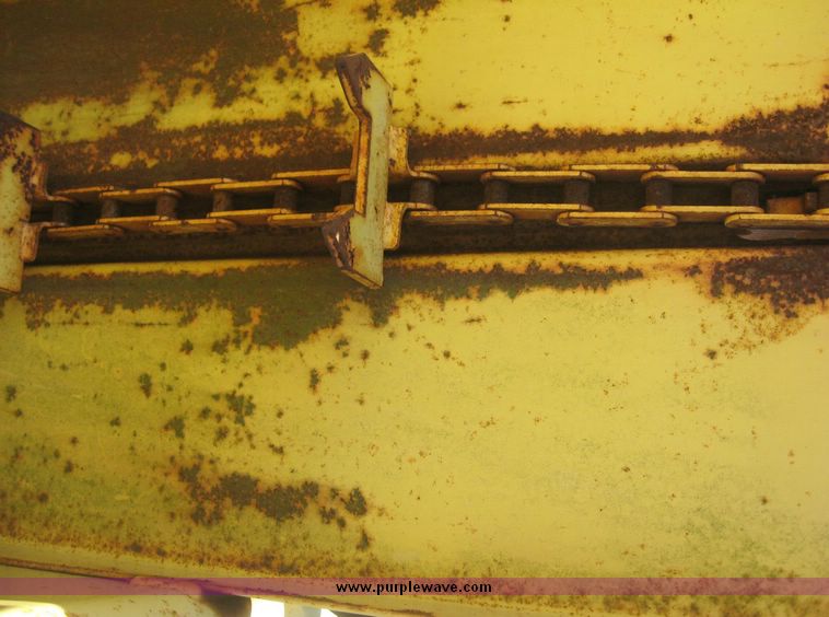 image for item 7999 New Holland 1033 pull type stack hand