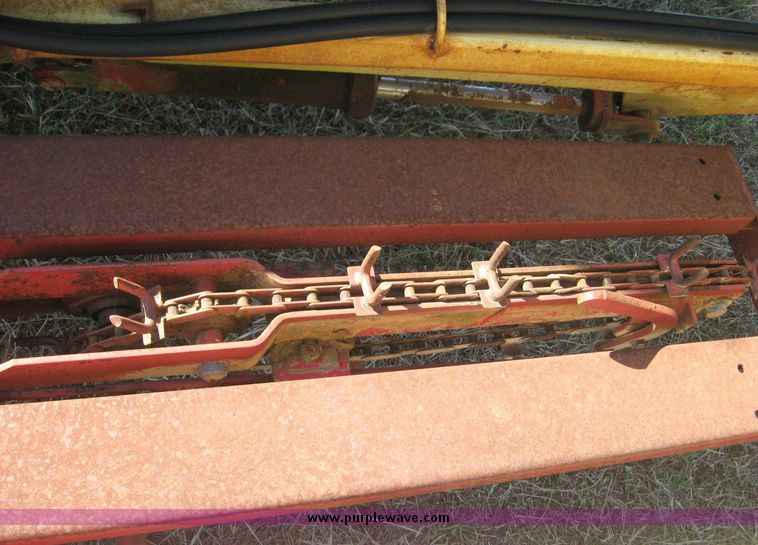 image for item 7999 New Holland 1033 pull type stack hand