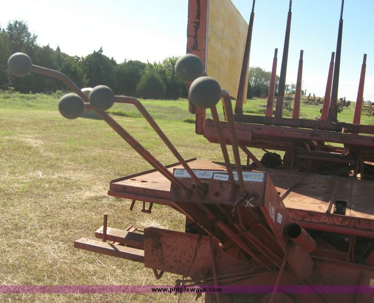 image for item 7999 New Holland 1033 pull type stack hand