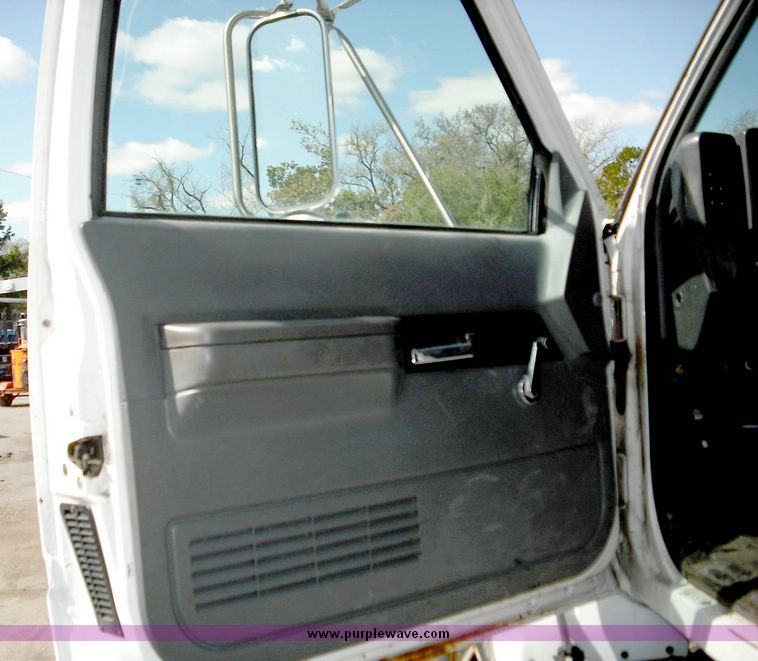 image for item 3826 2000 GMC C7500 dump truck with plow and spreader controls