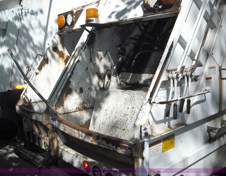 image for item 3883 1997 Crane Carrier Centurion low entry refuse truck with rear loader