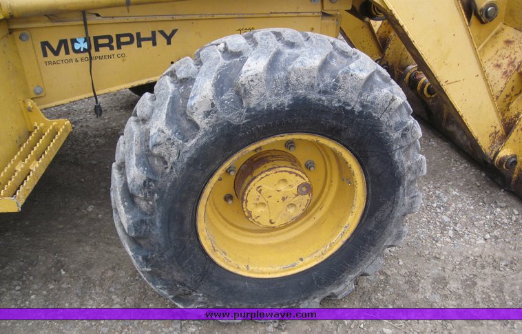 image for item 3911 1999 John Deere 310SE loader backhoe