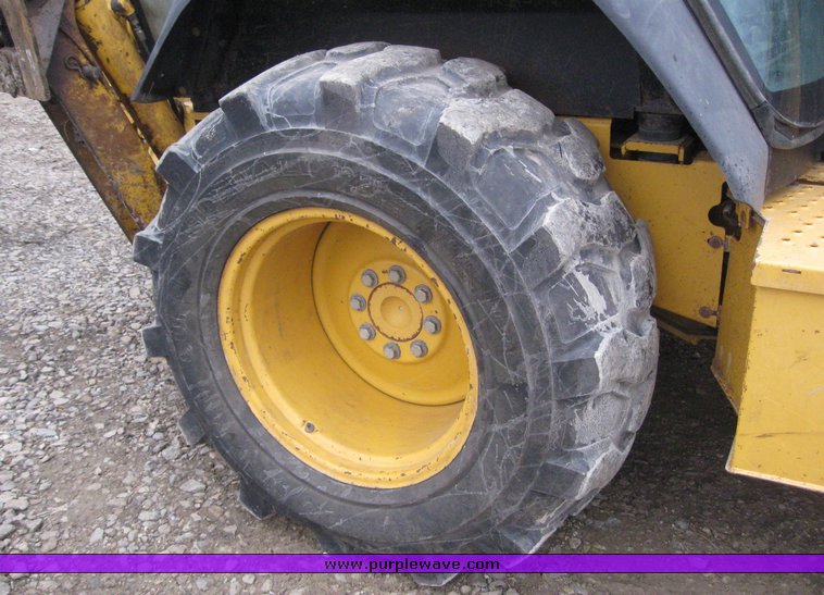 image for item 3911 1999 John Deere 310SE loader backhoe