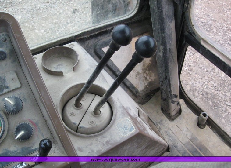 image for item 3911 1999 John Deere 310SE loader backhoe