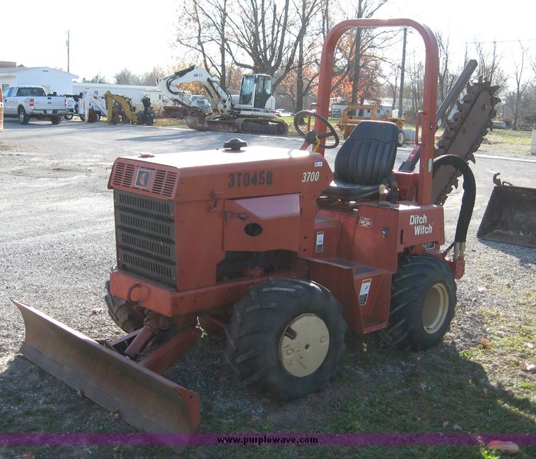 image for item 6565 2002 Ditch Witch 3700 trencher with front blade