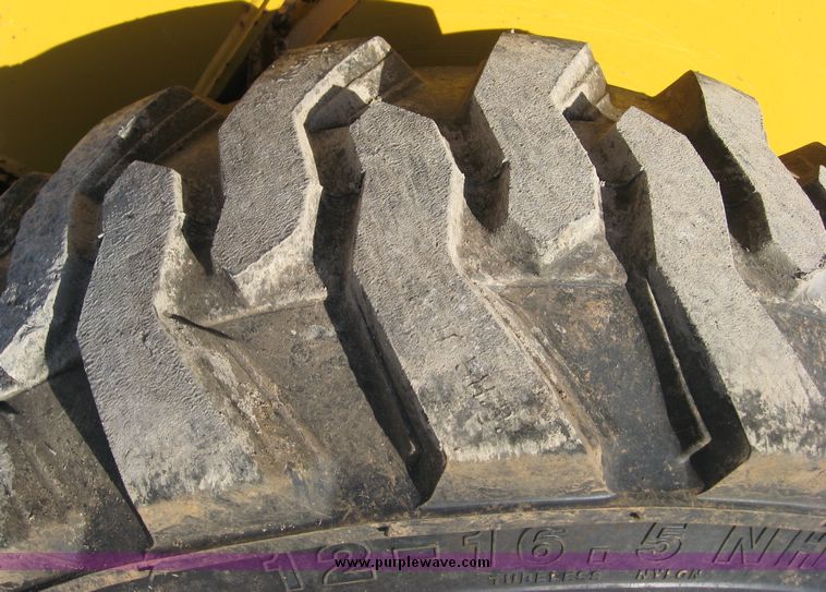 image for item 6567 2006 John Deere 325 skid steer