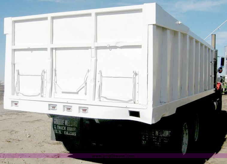 image for item 6439 1977 GMC 9500 tandem axle truck with 20' combination grain and silage bed