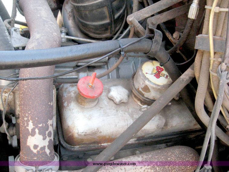 image for item 6439 1977 GMC 9500 tandem axle truck with 20' combination grain and silage bed