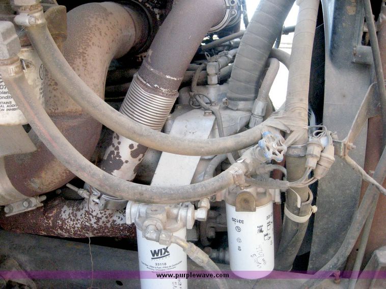 image for item 6439 1977 GMC 9500 tandem axle truck with 20' combination grain and silage bed