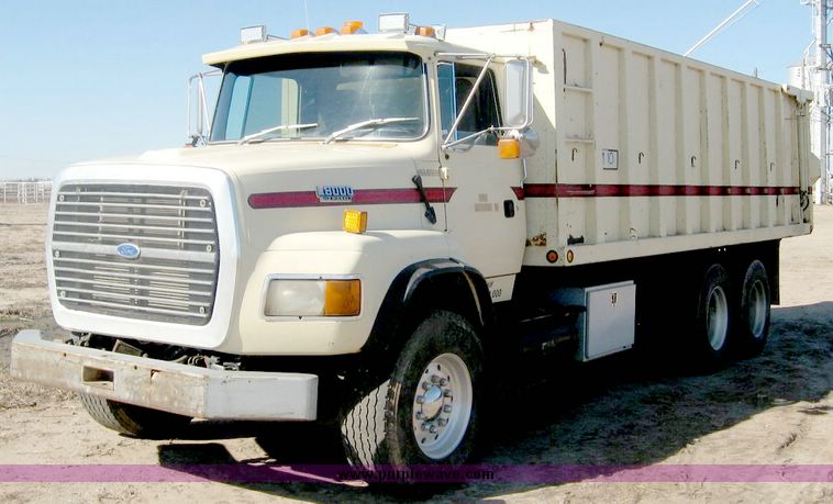 image for item 6440 1993 Ford L8000 tandem axle truck with 22' combination silage and grain bed