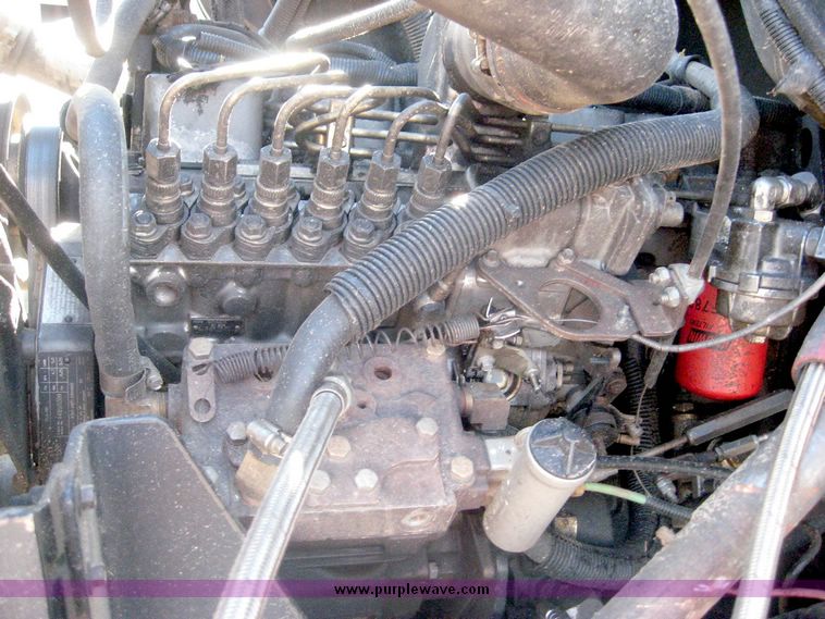 image for item 6446 1993 Ford L7000 truck with Roto-Mix 600-16 feed mixer box