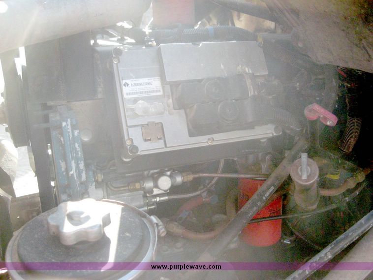 image for item 6447 1999 International 2000 SERIES 2654 tandem axle truck with Harsh 810 feed mixer box