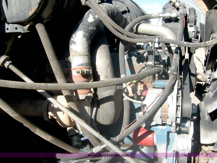 image for item 6447 1999 International 2000 SERIES 2654 tandem axle truck with Harsh 810 feed mixer box