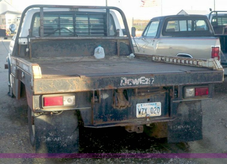1993 Ford F 350 pickup with DewEze 275 bale bed in Great Bend, KS