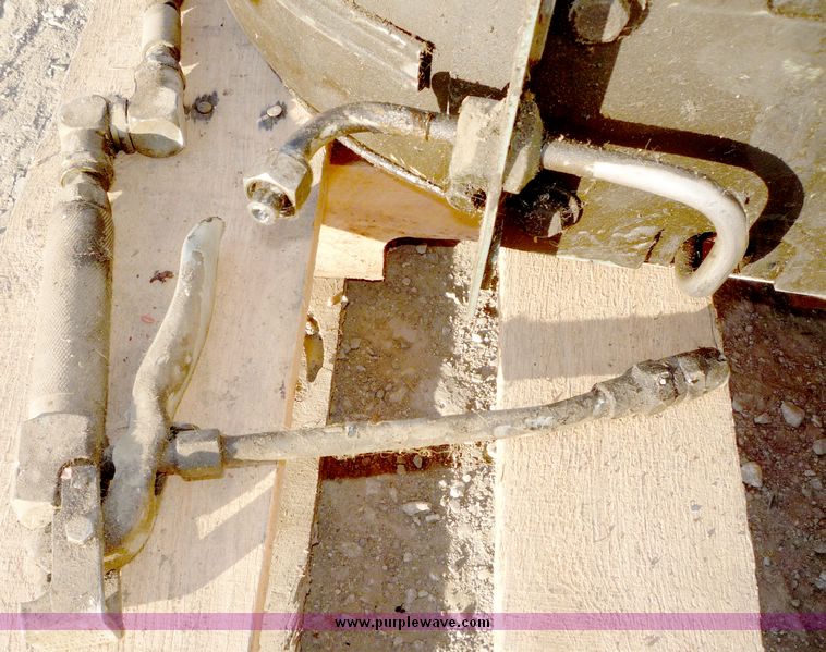 Aro retractable grease gun hose reel in Lawrence, KS Item 5042 sold Purple Wave