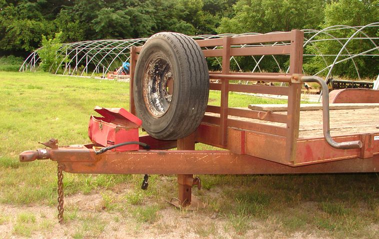 image for item 5896 1988 24' flatbed trailer with removable side racks and ramps