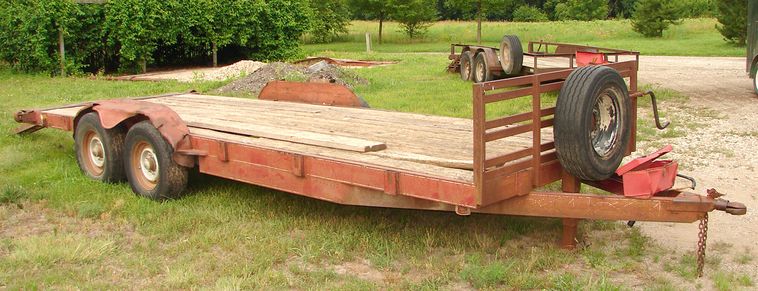image for item 5896 1988 24' flatbed trailer with removable side racks and ramps
