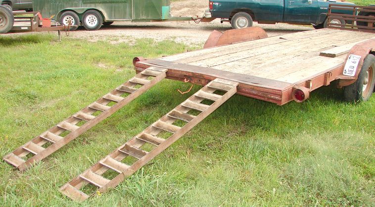 image for item 5896 1988 24' flatbed trailer with removable side racks and ramps