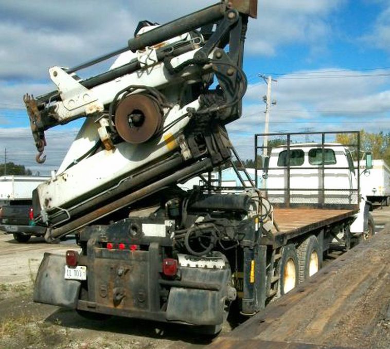 image for item 1000 1999 Sterling LT9513 tri-axle boom truck
