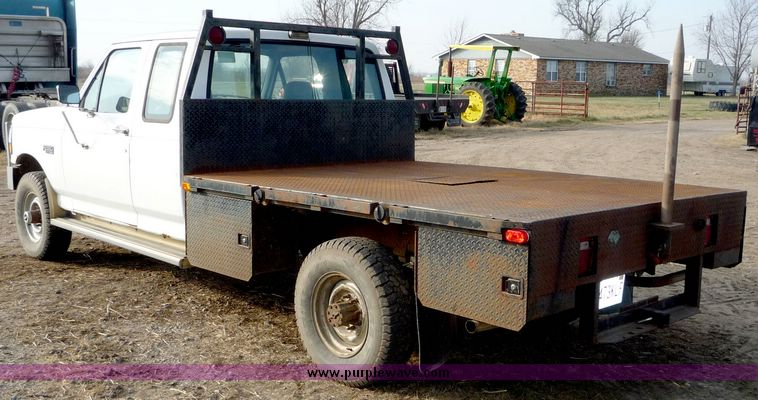 image for item 5124 1992 Ford F-250 extended cab pickup with flatbed and bale spike