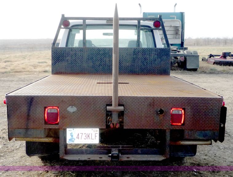 image for item 5124 1992 Ford F-250 extended cab pickup with flatbed and bale spike