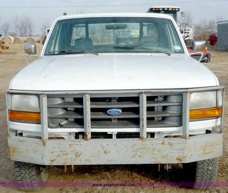 image for item 5124 1992 Ford F-250 extended cab pickup with flatbed and bale spike