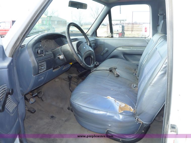 image for item 5124 1992 Ford F-250 extended cab pickup with flatbed and bale spike