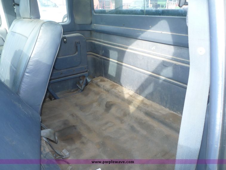 image for item 5124 1992 Ford F-250 extended cab pickup with flatbed and bale spike