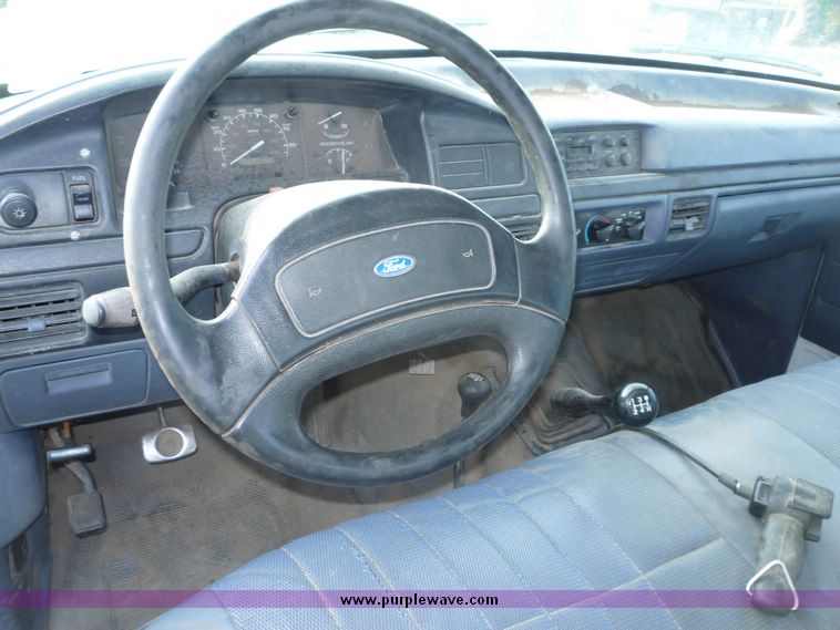 image for item 5124 1992 Ford F-250 extended cab pickup with flatbed and bale spike