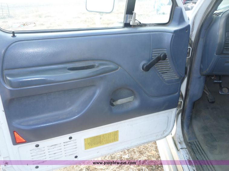 image for item 5124 1992 Ford F-250 extended cab pickup with flatbed and bale spike