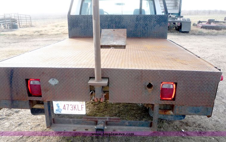 image for item 5124 1992 Ford F-250 extended cab pickup with flatbed and bale spike