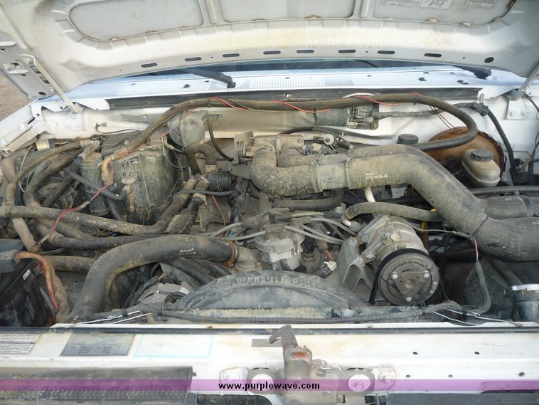 image for item 5124 1992 Ford F-250 extended cab pickup with flatbed and bale spike