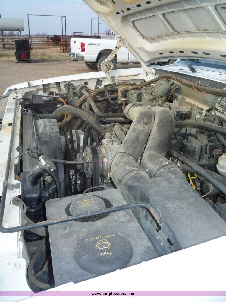 image for item 5124 1992 Ford F-250 extended cab pickup with flatbed and bale spike