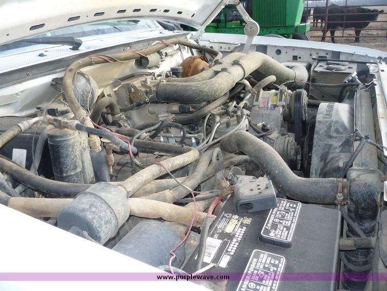 image for item 5124 1992 Ford F-250 extended cab pickup with flatbed and bale spike