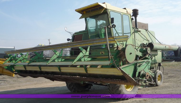 image for item 5134 1973 John Deere 7700 combine with 222 John Deere 22' rigid platform with bat reel