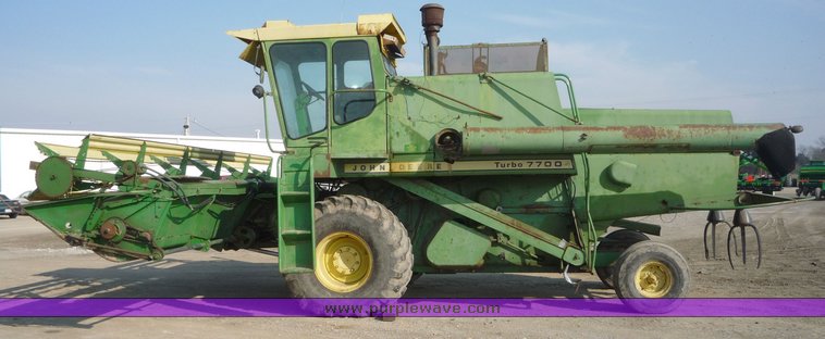 image for item 5134 1973 John Deere 7700 combine with 222 John Deere 22' rigid platform with bat reel