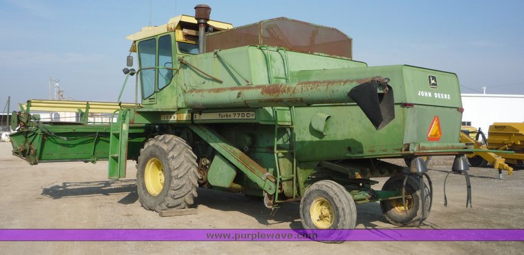 image for item 5134 1973 John Deere 7700 combine with 222 John Deere 22' rigid platform with bat reel