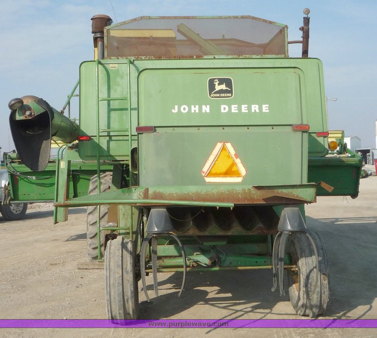 image for item 5134 1973 John Deere 7700 combine with 222 John Deere 22' rigid platform with bat reel