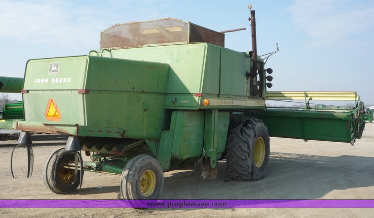 image for item 5134 1973 John Deere 7700 combine with 222 John Deere 22' rigid platform with bat reel