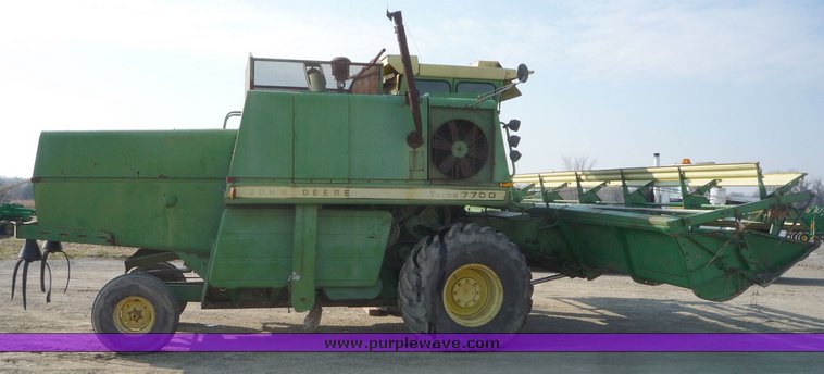image for item 5134 1973 John Deere 7700 combine with 222 John Deere 22' rigid platform with bat reel