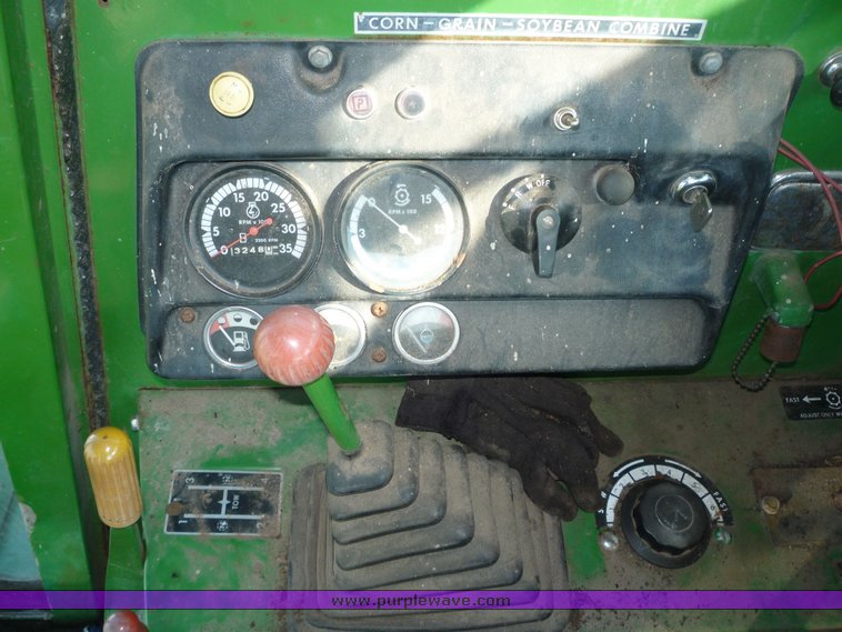 image for item 5134 1973 John Deere 7700 combine with 222 John Deere 22' rigid platform with bat reel