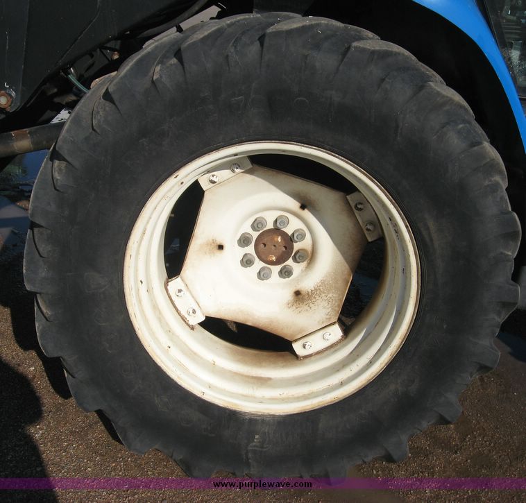 image for item 6611 1998 New Holland TV140 bi-directional 4WD tractor