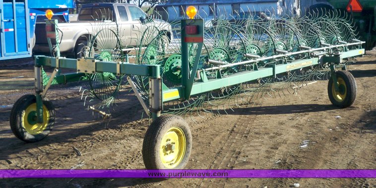 image for item 7002 2006 John Deere 704 wheel rake