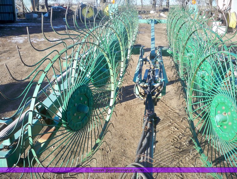 image for item 7002 2006 John Deere 704 wheel rake